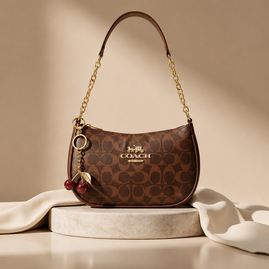 Signature Brown Coach Shoulder Bag with Cherry keychain