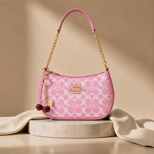 Signature Pink Coach Shoulder Bag with Cherry keychain